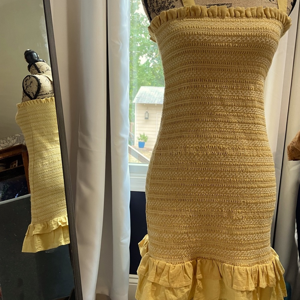 Ruffle top and bottom body con mini dress.